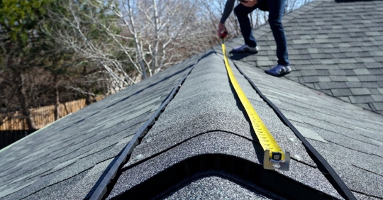 a person conducting a roof inspection